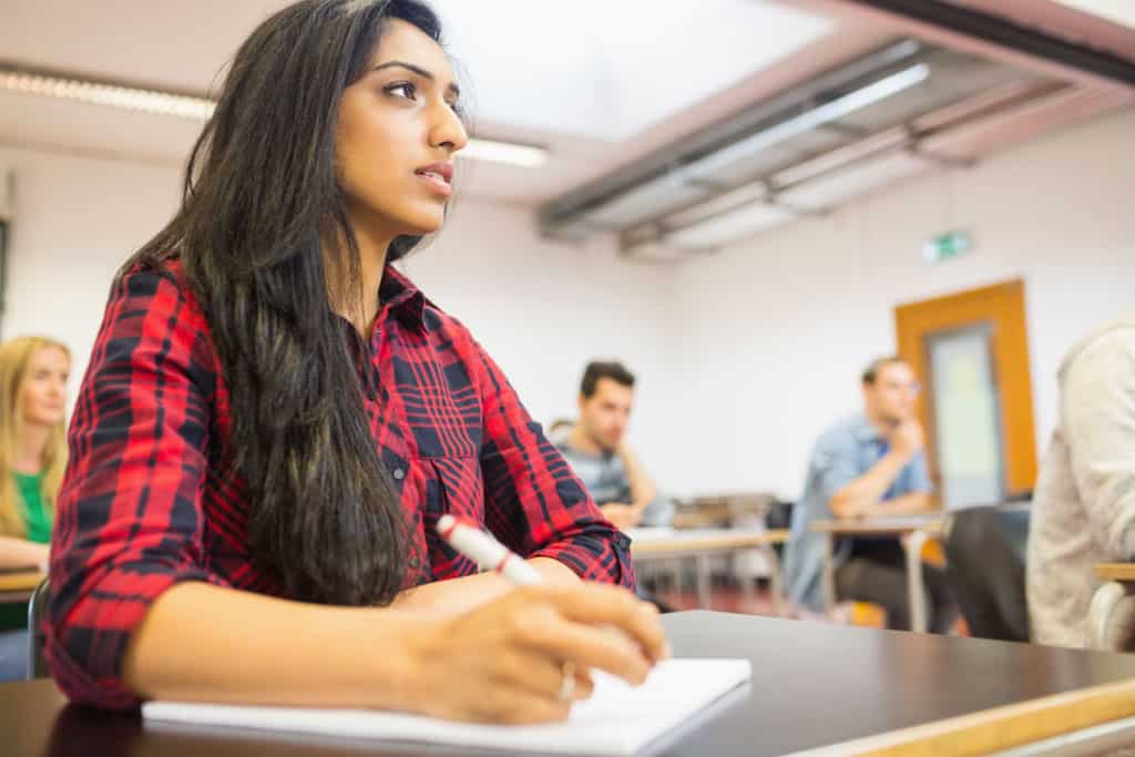 Girl taking notes in school planner